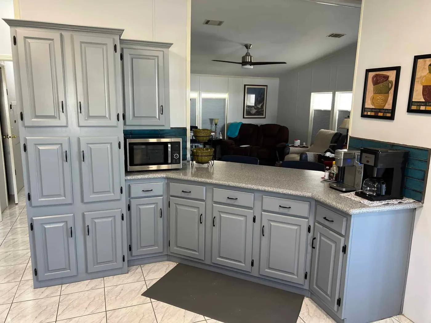 Gray refinished kitchen cabinets after refinishing