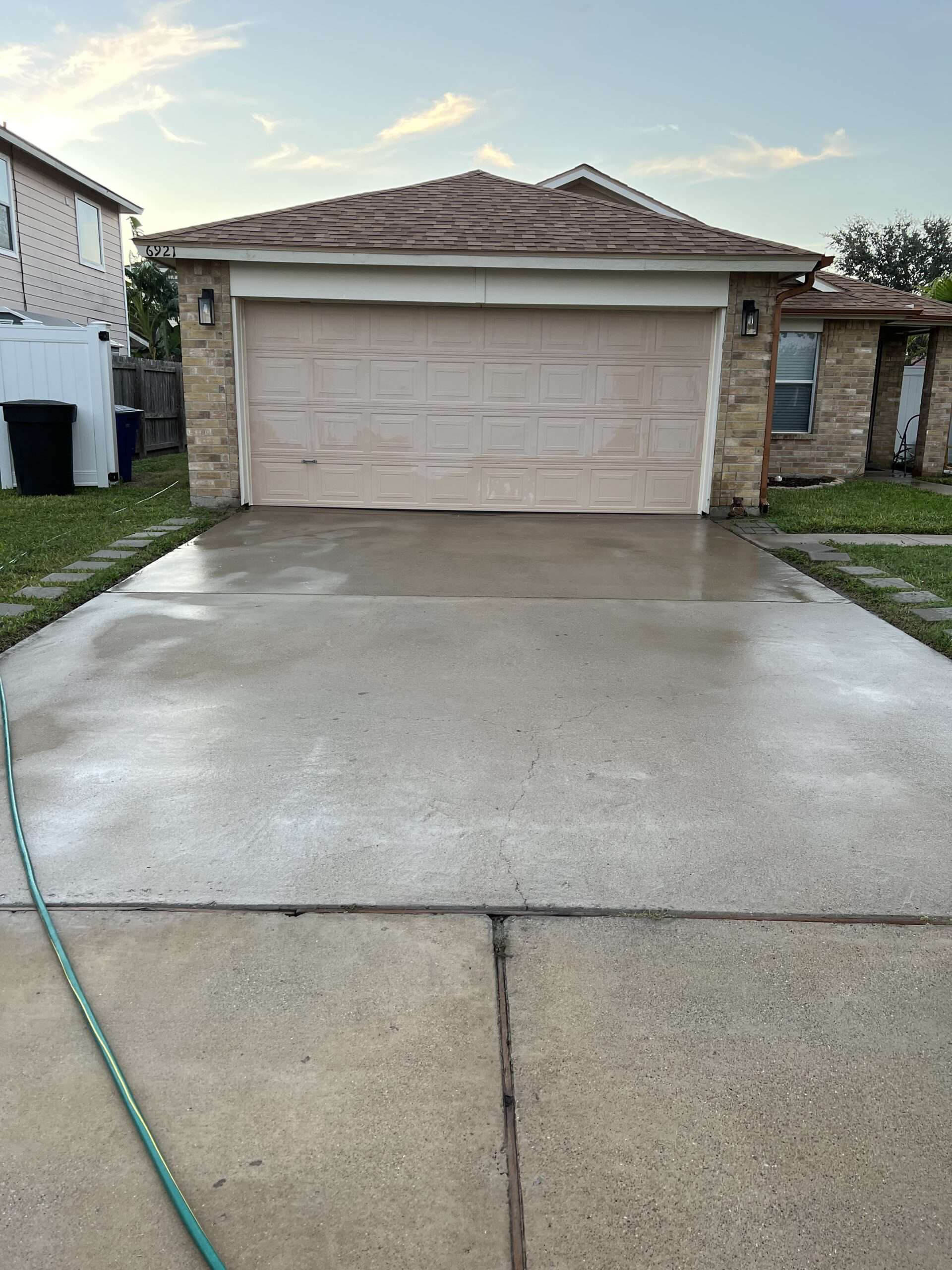 Driveway and garage apron after pressure washing