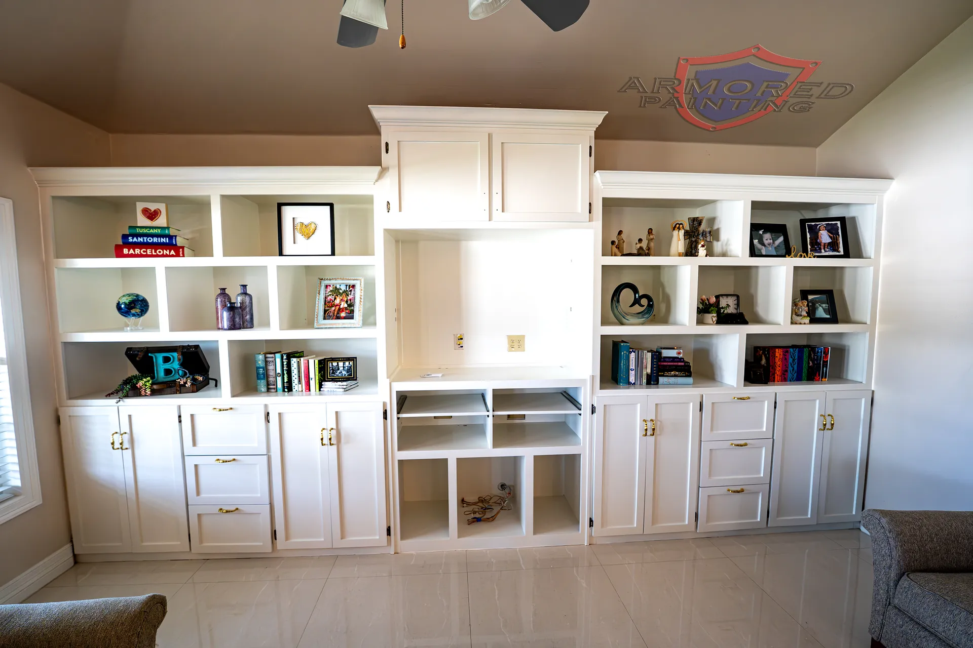 White refinished built-in shelving and cabinetry in a living room