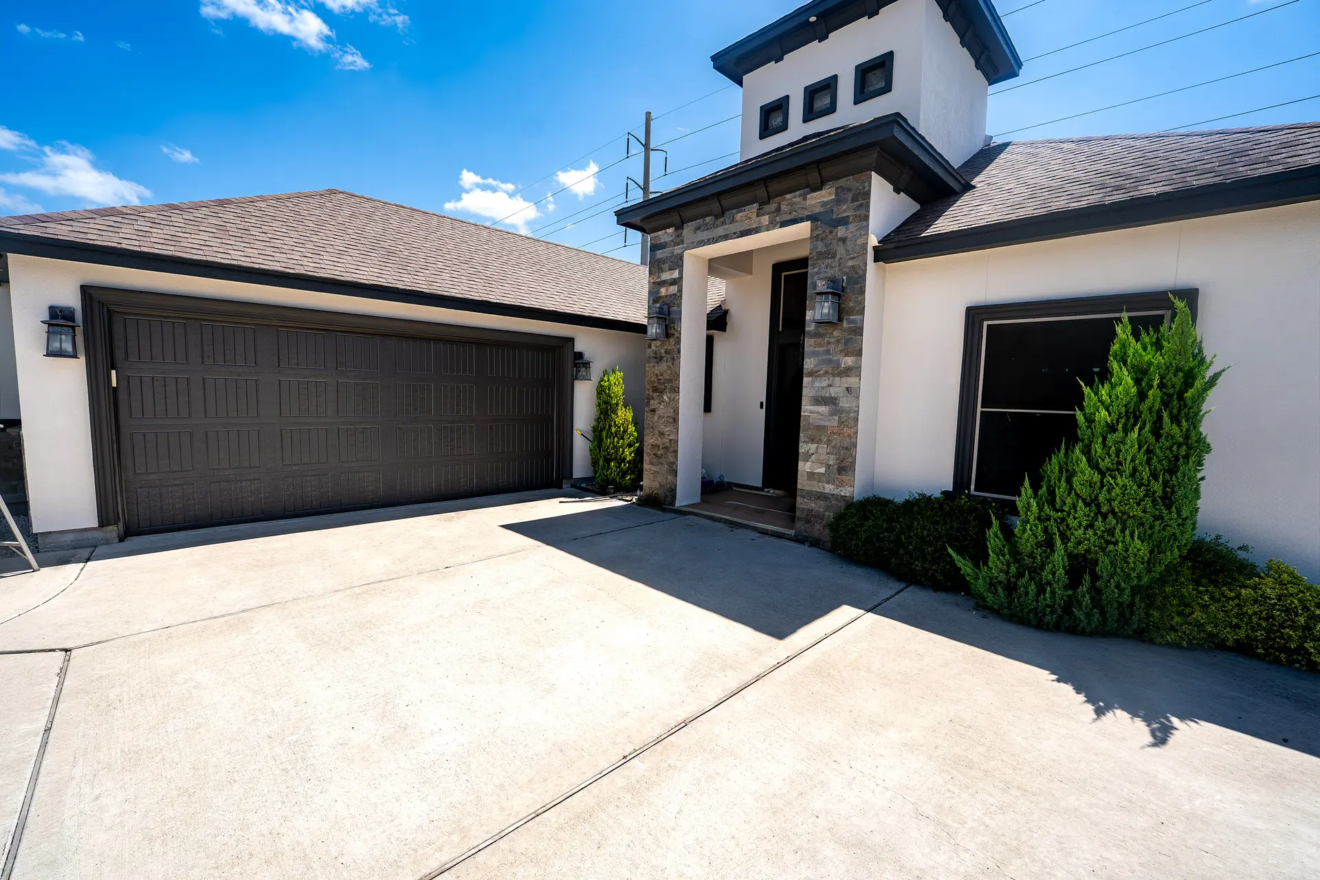 Modern two-story white stucco home after exterior painting